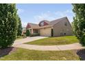 Beautiful home with a two-car garage, well-kept lawn, and inviting front entry at 1523 Anthology Dr, Durham, NC 27703