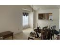 Open-concept living room with adjoining kitchen provides great flow for entertaining at 1819 Collier Rd, Durham, NC 27707