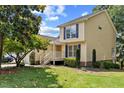 Beautiful two-story home with yellow siding, blue shutters, and a welcoming front porch at 20 Nicklaus Way, Clayton, NC 27520