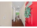 Bright foyer with hardwood floors, light walls, and an inviting view into the living room at 217 Macy Grove Dr, Chapel Hill, NC 27517