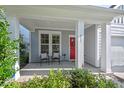 Inviting front porch with seating, offering a cozy spot to relax and enjoy the neighborhood views at 217 Macy Grove Dr, Chapel Hill, NC 27517