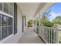 Inviting front porch with a charming porch swing, offering a relaxing outdoor space at 3109 Gold Dust Ln, Willow Springs, NC 27592