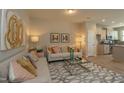 Bright living room with a modern rug, contemporary art, and comfortable sofas for relaxation at 366 Church St # 58, Wendell, NC 27591