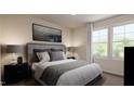 Bedroom with a large bed, side tables and windows for natural light at 40 Digging Time Ave, Princeton, NC 27569