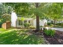 Home featuring a well-manicured lawn, beautiful landscaping, and a two-car garage at 410 Willingham Rd, Morrisville, NC 27560