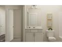 Well-lit bathroom featuring a vanity with storage and a neutral color palette at 51 Digging Time Ave, Princeton, NC 27569