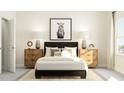Serene bedroom featuring a comfortable bed, stylish nightstands, and decor, creating a relaxing retreat at 5545 Cayden Cove Dr, Wendell, NC 27591