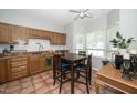 Cozy eat-in kitchen featuring wood cabinets, tile floors, and a bright breakfast nook area at 6008 River Lake Cir, Raleigh, NC 27604