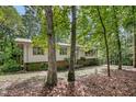 Traditional home exterior showing the landscaping with brick facade details at 623 Totten Pl, Chapel Hill, NC 27514