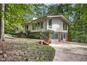 Two story home featuring multiple windows and a side entry door at 623 Totten Pl, Chapel Hill, NC 27514