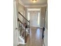 Bright foyer featuring hardwood flooring and staircase at 644 Wall Rd, Wendell, NC 27591