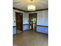 Dining room featuring wood floors, decorative trim and access to living areas at 759 Wheeler Dr, Angier, NC 27501