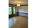 Bright dining room featuring wood floors, decorative trim and large windows at 759 Wheeler Dr, Angier, NC 27501