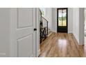 Inviting foyer features hardwood floors, staircase, and an entry door with sidelights at 808 Shiloh Hills Dr, Fuquay Varina, NC 27526