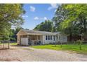 The exterior showcases a well-maintained yard with a fenced-in area for outdoor enjoyment at 1031 Old Us 421, Lillington, NC 27546
