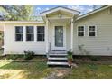 Inviting front porch with decorative plants and a charming entrance at 1031 Old Us 421, Lillington, NC 27546