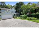 Two story home with a well manicured lawn and large driveway at 109 Crane Meadow Pl, Chapel Hill, NC 27514