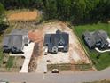 Aerial view of new home in development showing landscaping and proximity to green space at 1112 Delilia Ln, Wake Forest, NC 27587