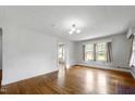 Spacious living area with hardwood floors and ample natural light at 2715 E Geer St, Durham, NC 27704
