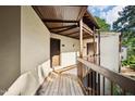 Inviting covered porch with wood detailing, providing a welcoming entrance to the home at 5082 Flint Ridge Pl, Raleigh, NC 27609