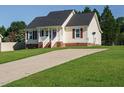 This single story home features a well maintained lawn and long driveway for easy access at 516 Yellow Berry, Wendell, NC 27591