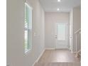 Bright entryway with hardwood floors and a view of the staircase at 94 Taverners Ln, Angier, NC 27501