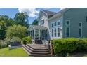 Expansive deck, hot tub, and screened porch make the perfect backyard retreat at 9701 Corktree Ct, Wake Forest, NC 27587