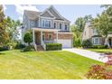 Beautiful two-story home with a stone facade and well-manicured front yard at 9701 Corktree Ct, Wake Forest, NC 27587