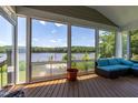 Enjoy beautiful lake views from the comfort of this screened porch at 9701 Corktree Ct, Wake Forest, NC 27587