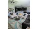 Spacious living room open to the kitchen, featuring a comfortable sectional and stylish decor at 109 E Webber Lane Ln, Clayton, NC 27527