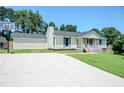 Wide driveway leading to a charming home with a basketball hoop and well-kept lawn at 111 Marshay Meadow Rd, Youngsville, NC 27596