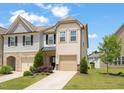 Charming townhome with a well-maintained lawn and attached one-car garage at 1137 Amber Shadow Dr, Durham, NC 27703