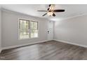 Hardwood flooring, ceiling fan, and front entrance offer a comforting view at 136 Dixie Ln, Youngsville, NC 27596