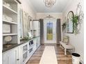 Inviting entryway featuring decorative shelving, stylish decor, and plenty of natural light at 190 Mitchells Chapel Road, Pittsboro, NC 27312