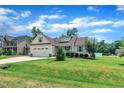 Charming one-story home with manicured lawn, American flag, and attached two-car garage at 22 Evie Dr, Smithfield, NC 27577