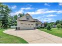 Well-maintained one-story home featuring a large driveway and a two-car attached garage at 22 Evie Dr, Smithfield, NC 27577