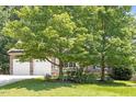 Charming home with stone accents, a two-car garage, and accessible ramp at 23 Northern Way Ct, Durham, NC 27712