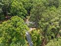 Aerial view of a home surrounded by lush green trees, offering privacy and a serene natural setting at 235 Mccauley St # D, Chapel Hill, NC 27516