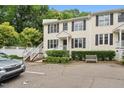 Inviting townhome with well-manicured landscaping, white trim, and a bench for relaxing at 2603 Stafford Ave # Apt C, Raleigh, NC 27607