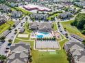 Aerial view of the community pool, playground, tennis court, and amenities at 333 Amber Acorn Ave, Raleigh, NC 27603