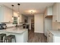 Modern kitchen with granite countertops, stainless steel appliances, and ample cabinet space at 438 N Hickory St, Angier, NC 27501