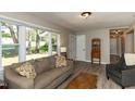 Bright living room features large windows and stylish, neutral decor at 438 N Hickory St, Angier, NC 27501