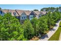 Exterior showing townhomes with well-maintained lawns and trees at 4963 Highcroft Dr, Cary, NC 27519