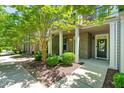 Charming front porch with brick accents and well-maintained landscaping, offering a welcoming entrance at 4963 Highcroft Dr, Cary, NC 27519