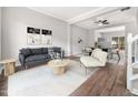 Bright living room featuring hardwood floors and a neutral color palette at 5505 Crabtree Park Ct, Raleigh, NC 27612
