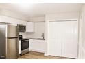 Modern kitchen featuring stainless steel appliances, granite countertops, and white subway tile backsplash at 621 Reservoir St, Durham, NC 27703