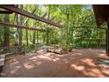Inviting brick patio with a pergola, perfect for outdoor dining and relaxation at 6700 Falconbridge Rd, Chapel Hill, NC 27517