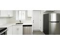 Updated kitchen with stainless steel dishwasher and fridge and convenient access to the back door at 800 Pritchard Avenue Ext # H9, Chapel Hill, NC 27516