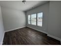 Bright bedroom with hardwood floors and natural light at 801 Portland Rose Dr, Knightdale, NC 27545