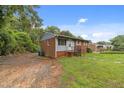 A cozy, brick home featuring a neat front yard and comfortable setting at 807 New St, Graham, NC 27253